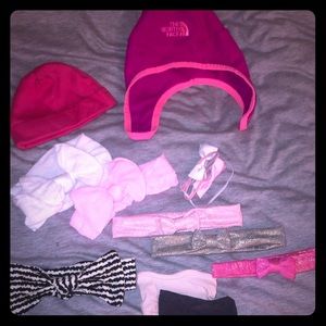 Collection of baby girl hats and accessories